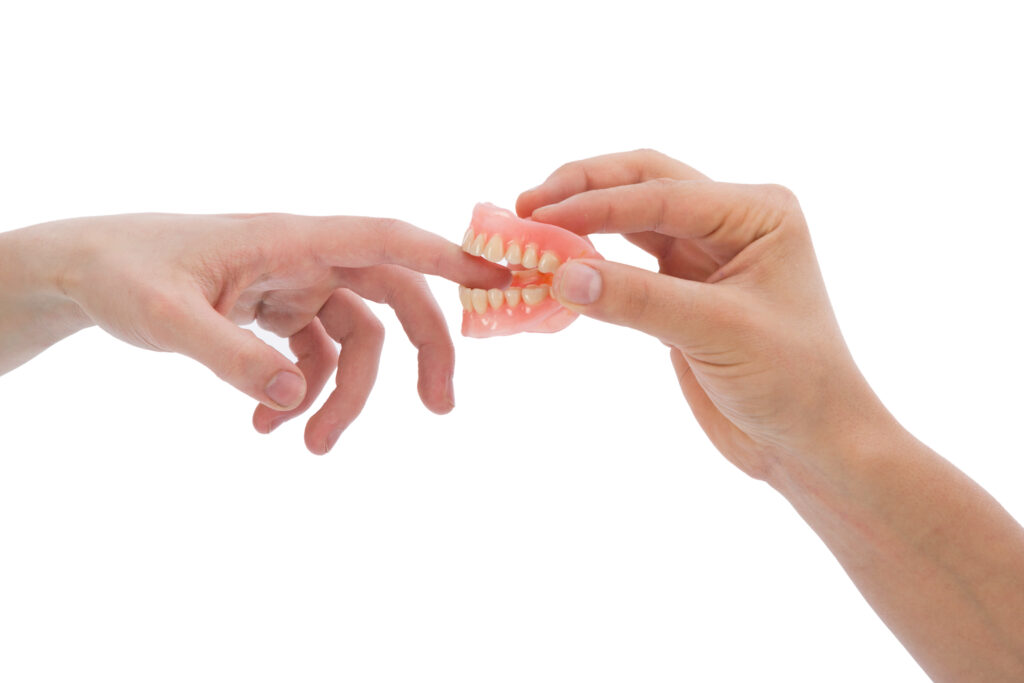 Dentures biting someones finger. If you dont take care of your dentures they wont take care of you. 
